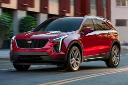 Red 2022 Cadillac XT4 Sport driving